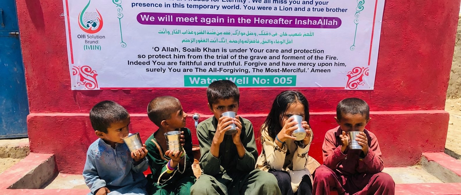 Children drinking clean water from a solar water pump installation